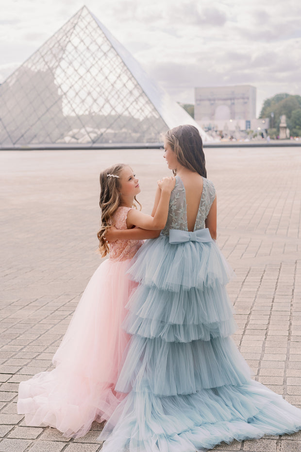 Girls' elegant tulle dress in dusty blue in a high-low hemline style. Tulle skirt, long tulle train, embroidered top and open back create an elegant, modern princess look. Handmade with love. Occasions: Wedding, Birthday party, Prom, Flower girl, Eid, and other events.