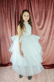 Ankle-length tulle girl dress with a multi-layered tulle skirt, tulle pleated top with a high collar and pearl embellishments along the neckline and the waistline. Princess girl dress for a girl birthday party, flower girl dress, wedding, communion.