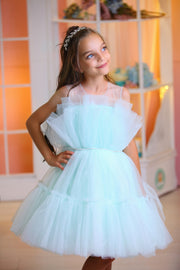 Knee-length elegant girl dress in a light blue colour with a voluminous tulle skirt and top embellished with a pearl ribbon at the waistline. For special occasions: Wedding, Birthday party, Prom, Flower girl, Eid, and other events.