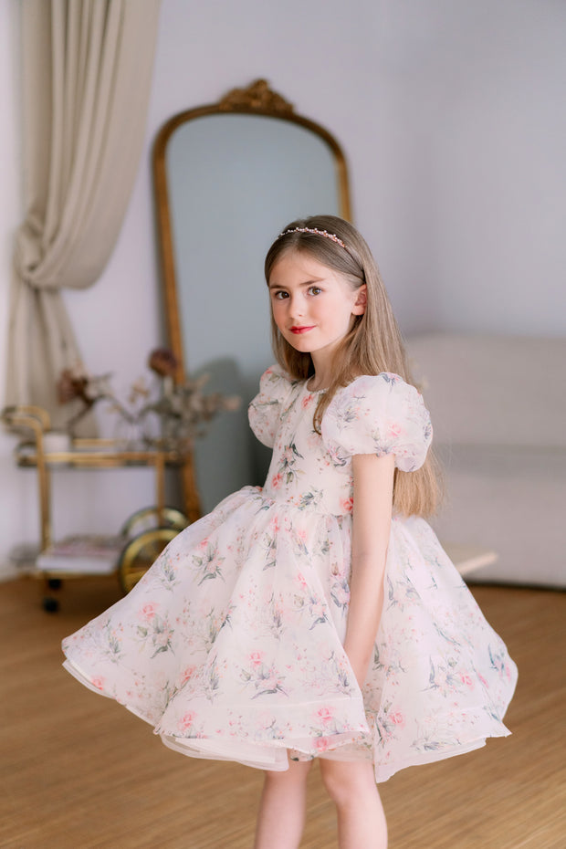 Knee-length voluminous girls' tutu dress in white with all-over soft floral print and short puffy sleeves. Handmade with love. For special occasions: Wedding, Birthday party, Prom, Flower girl, Eid, and other events.