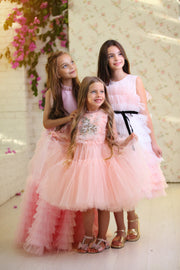 Midi length princess girl dress with ombre effect in white and pink with a ruffled tulle skirt and contrasting black ribbon at the waistline. For special occasions: Wedding, Birthday party, Prom, Flower girl, Eid, and other events.