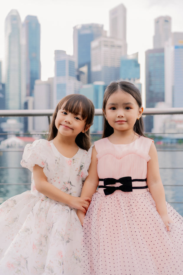 Knee-length apricot tulle dress for girls with a voluminous tulle skirt, black polka dot pattern and two cute ribbons at the waistline. Handmade with love. Occasions: Wedding, Birthday party, Prom, Flower girl, Eid, and other events.