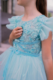 Knee-length girls' tulle dress in a beautiful aquamarine color, with a multi-layer tulle skirt, open back, floral embroidery, and ruffled tulle sleeves. Handmade with love. For special occasions: Wedding, Birthday party, Prom, Flower girl, Eid, and other events.