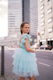 Knee-length girls' tulle dress in a beautiful aquamarine color, with a multi-layer tulle skirt, open back, floral embroidery, and ruffled tulle sleeves. Handmade with love. For special occasions: Wedding, Birthday party, Prom, Flower girl, Eid, and other events.