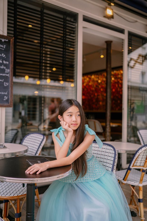 Elegant, a-line girls' dress in a beautiful aquamarine color, featuring a peplum style top embroidered with pearls and decorated with a belt and ribbons. Handmade with love. Occasions: Wedding, Birthday party, Prom, Flower girl, Eid, and other events.