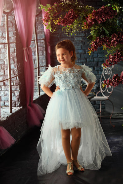 Elegant girls' tulle dress in light blue for any special occasion. Light tulle skirt with an asymmetrical, high-low hemline, top with floral lace and beautiful feather sleeves. Handmade with love. Occasions: Wedding, Birthday party, Prom, Flower girl, Eid, and other events.