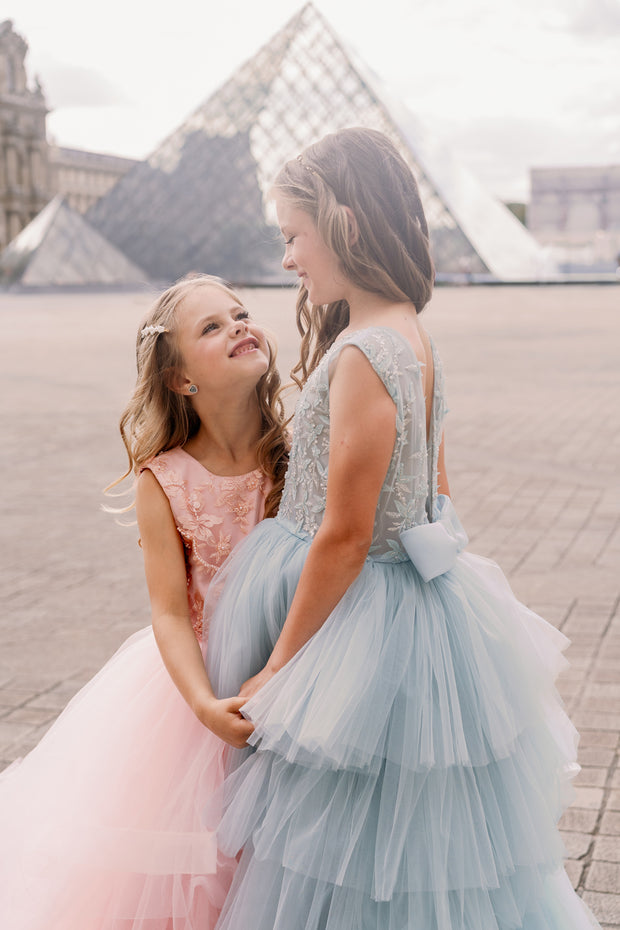 Girls' elegant tulle dress in dusty blue in a high-low hemline style. Tulle skirt, long tulle train, embroidered top and open back create an elegant, modern princess look. Handmade with love. Occasions: Wedding, Birthday party, Prom, Flower girl, Eid, and other events.