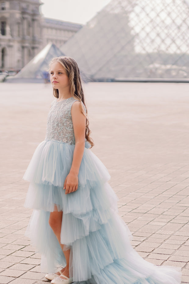 Girls' elegant tulle dress in dusty blue in a high-low hemline style. Tulle skirt, long tulle train, embroidered top and open back create an elegant, modern princess look. Handmade with love. Occasions: Wedding, Birthday party, Prom, Flower girl, Eid, and other events.