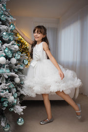 Voluminous, midi white tulle dress with tulle ruffle details, tulle top with sequin embroidery and a big bow accent at the waistline. Handmade with love. For special occasions: Wedding, Birthday party, Prom, Flower girl, Eid, and other events.