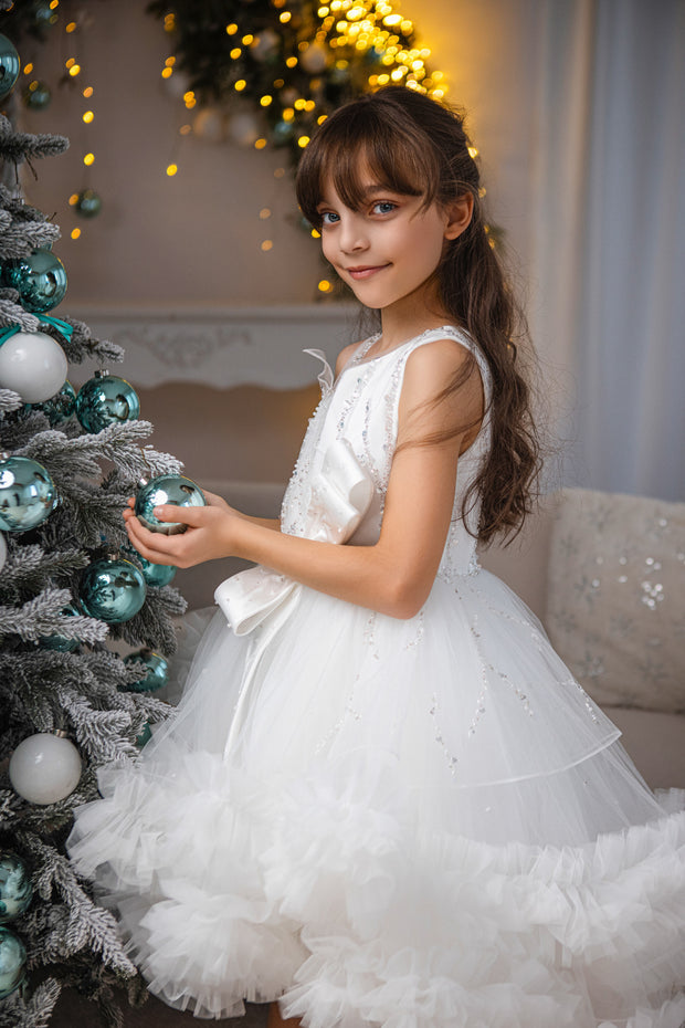 Voluminous, midi white tulle dress with tulle ruffle details, tulle top with sequin embroidery and a big bow accent at the waistline. Handmade with love. For special occasions: Wedding, Birthday party, Prom, Flower girl, Eid, and other events.