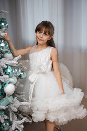 Voluminous, midi white tulle dress with tulle ruffle details, tulle top with sequin embroidery and a big bow accent at the waistline. Handmade with love. For special occasions: Wedding, Birthday party, Prom, Flower girl, Eid, and other events.