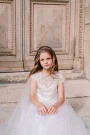 Long, white tulle dress with an a-line skirt, satin top with lace details and long tulle cape. Handmade with love. For special occasions: Wedding, Birthday party, Prom, Flower girl, First Communion, Eid, and other events.