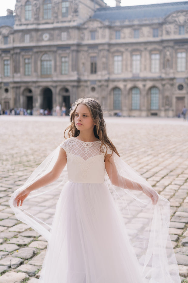 Long, white tulle dress with an a-line skirt, satin top with lace details and long tulle cape. Handmade with love. For special occasions: Wedding, Birthday party, Prom, Flower girl, First Communion, Eid, and other events.