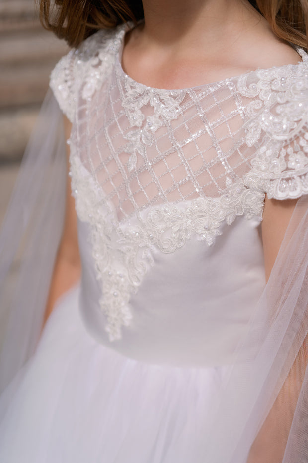 Long, white tulle dress with an a-line skirt, satin top with lace details and long tulle cape. Handmade with love. For special occasions: Wedding, Birthday party, Prom, Flower girl, First Communion, Eid, and other events.