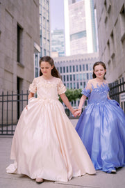 Long, princess ball gown in a soft vanilla-creme color, with a long, voluminous satin skirt, satin top with short sleeves, 3D floral embroidery and mesh details. Handmade with love. Occasions: Wedding, Birthday party, Prom, Flower girl, Eid, and other events.