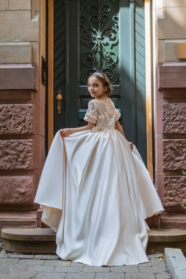 Long, princess ball gown in a soft vanilla-creme color, with a long, voluminous satin skirt, satin top with short sleeves, 3D floral embroidery and mesh details. Handmade with love. Occasions: Wedding, Birthday party, Prom, Flower girl, Eid, and other events.