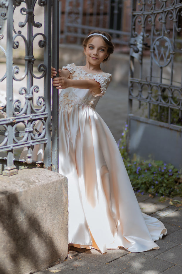 Long, princess ball gown in a soft vanilla-creme color, with a long, voluminous satin skirt, satin top with short sleeves, 3D floral embroidery and mesh details. Handmade with love. Occasions: Wedding, Birthday party, Prom, Flower girl, Eid, and other events.