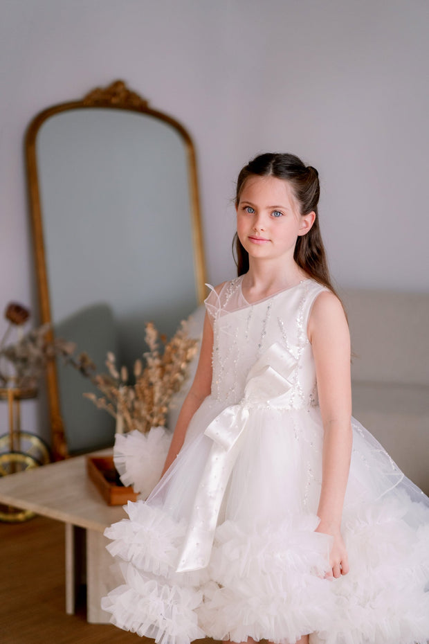 Voluminous, midi white tulle dress with tulle ruffle details, tulle top with sequin embroidery and a big bow accent at the waistline. Handmade with love. For special occasions: Wedding, Birthday party, Prom, Flower girl, Eid, and other events.