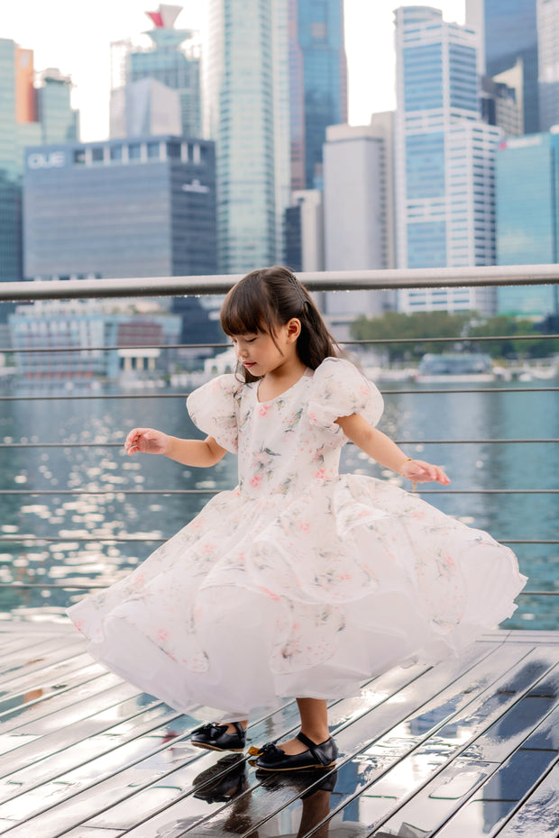 White tutu dress with floral print and puffy sleeves