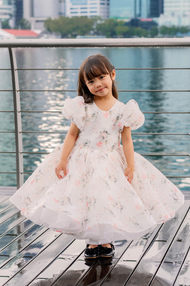 White tutu dress with floral print and puffy sleeves