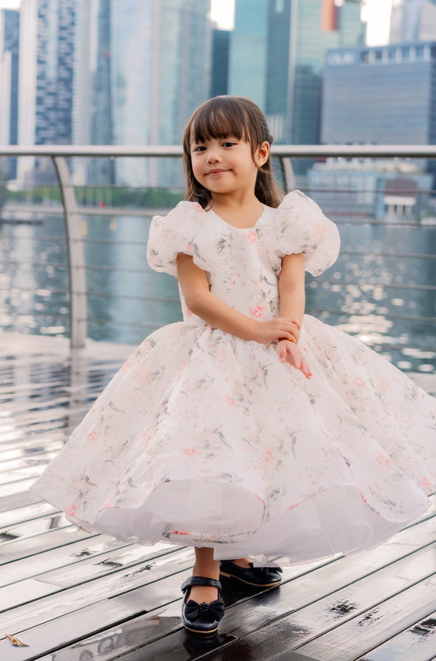 White tutu dress with floral print and puffy sleeves