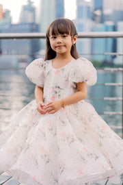 White tutu dress with floral print and puffy sleeves