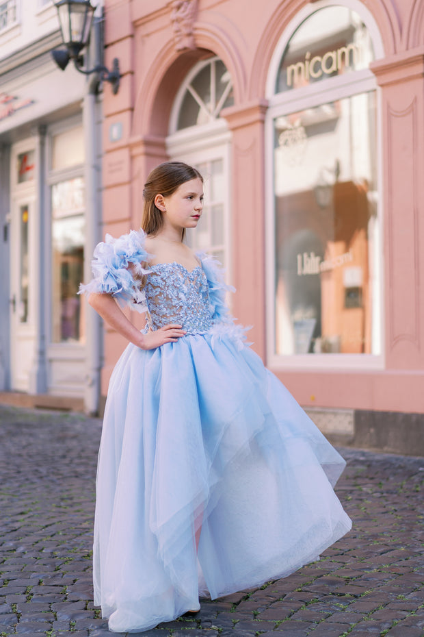 Girl princess dress in light blue for any special occasion. Light tulle skirt with a high-low hemline, top with floral appliqués and beautiful feather sleeves. Girl dress for special occasions: flower girls, weddings, girl birthday party, Eid.