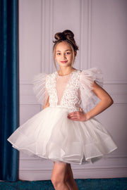 Short white girl tutu dress with a voluminous, ballerina skirt, embroidered tulle top and ruffled tulle sleeves. Handmade girl dress for special occasions: Christmas, New Year's Eve, flower girls, weddings, birthdays, communion.