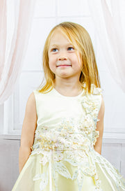 handmade short yellow flower girl's dress with an A-line tulle skirt and pastel color floral embroidery