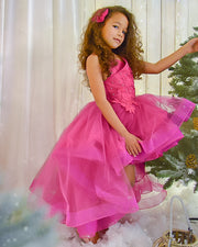 Festive bright pink girl dress with high-low hem, long tulle train and floral embroidery. The dress is for holiday season, Christmas, New Year, weddings, Eid, birthdays, parties, flower girls and other special formal events and occasions.