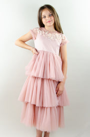 Ankle-length princess dress in a baby pink color with multi-layered tulle skirt, transparent ruffled sleeves and floral embroidery on the front and back satin bodice. Girl dress for special occasions: flower girls, weddings, birthday party, communion, Eid.