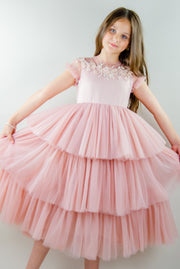 Ankle-length princess dress in a baby pink color with multi-layered tulle skirt, transparent ruffled sleeves and floral embroidery on the front and back satin bodice. Girl dress for special occasions: flower girls, weddings, birthday party, communion, Eid.