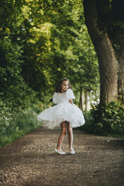 Knee-length white tulle flower girl dress with short sleeves and all-over 3D flower embroidery