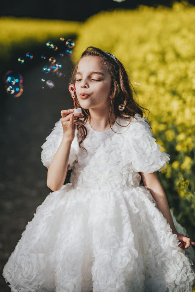 Knee-length white tulle flower girl dress with short sleeves and all-over 3D flower embroidery, for special occasions: Wedding, Birthday party, Prom, Flower girl, Eid, and other events. 