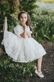 Knee-length white tulle flower girl dress with short sleeves and all-over 3D flower embroidery, for special occasions: Wedding, Birthday party, Prom, Flower girl, Eid, and other events. 