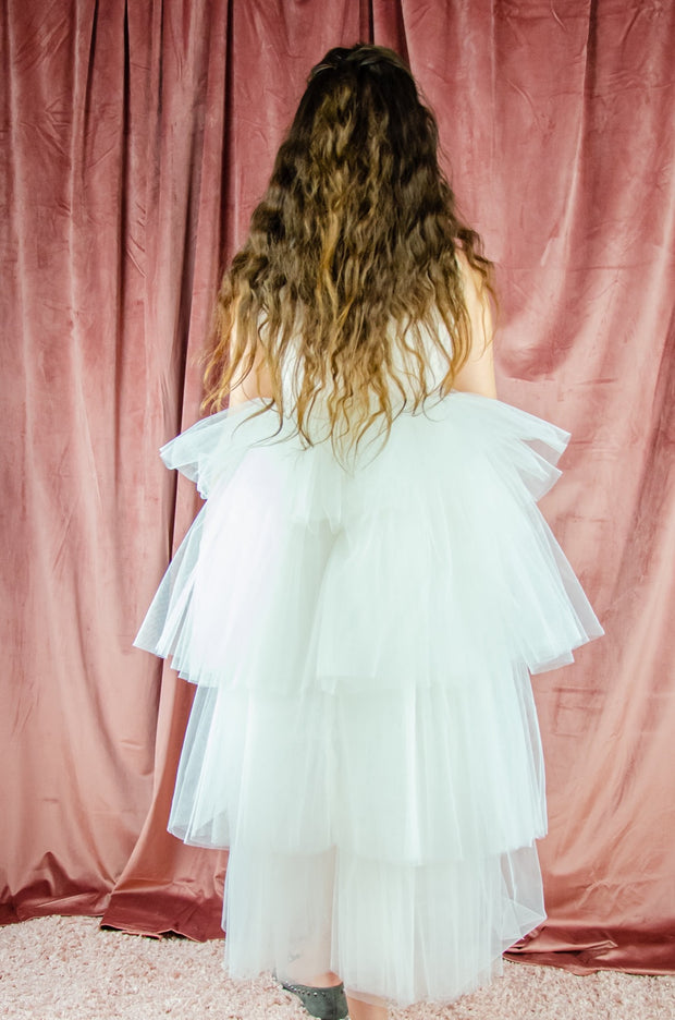 Ankle-length tulle girl dress with a multi-layered tulle skirt, tulle pleated top with a high collar and pearl embellishments along the neckline and the waistline. Princess girl dress for a girl birthday party, flower girl dress, wedding, communion.