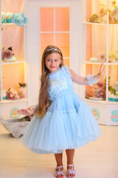 Princess girl dress in baby blue with a voluminous, multi-layer tulle skirt, long, transparent tulle sleeves and satin top with pastel coloured floral embroidery. For Special occasions: Wedding, Birthday party, Prom, Flower girl, Eid, and other events.