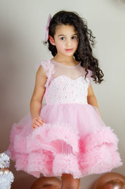Festive barbie pink girl dress with pearls and tulle ruffles. The dress is for holiday season, Christmas, New Year, weddings, Eid, birthdays, parties, flower girls and other special formal events and occasions.
