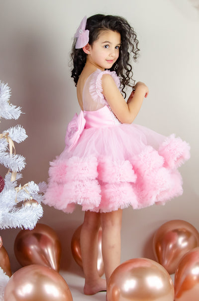 Festive barbie pink girl dress with pearls and tulle ruffles. The dress is for holiday season, Christmas, New Year, weddings, Eid, birthdays, parties, flower girls and other special formal events and occasions.