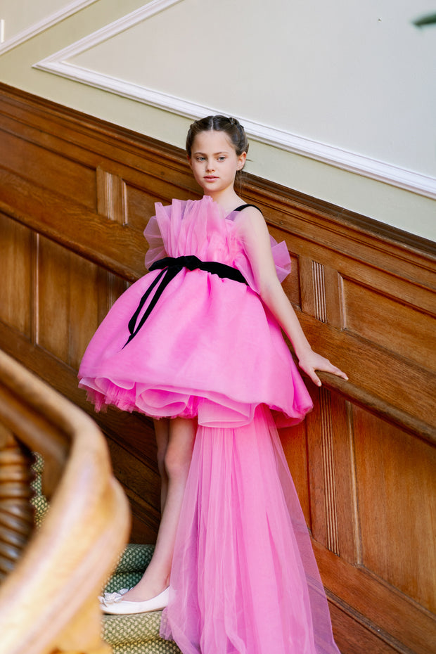 Festive, bright pink high-low hemline girl dress for special occasions. Modern princess girl dress with a bright pink tutu skirt and long tulle train. Black straps and black ribbon at the waistline. Handmade with love. Occasions: Christmas, New Year's Eve, Wedding, Birthday party, Prom, Flower girl, Eid.
