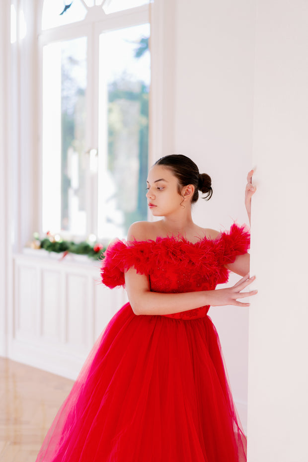 Floor length princess ball gown in bright pink, with a long, voluminous tulle skirt, satin top with embroidery and off-the-shoulder neckline with tulle ruffles and feather details. For special occasions: Wedding, Birthday party, Prom, Flower girl, Eid, and other events.