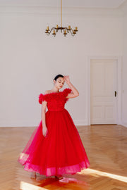 Festive, floor length princess ball gown in bright pink, with a long, voluminous tulle skirt, satin top with embroidery and off-the-shoulder neckline with tulle ruffles and feather details. For special occasions: Christmas, New Year's Eve, Wedding, Birthday party, Prom, Flower girl, Eid, and other events.