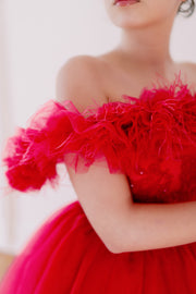 Festive, floor length princess ball gown in bright pink, with a long, voluminous tulle skirt, satin top with embroidery and off-the-shoulder neckline with tulle ruffles and feather details. For special occasions: Christmas, New Year's Eve, Wedding, Birthday party, Prom, Flower girl, Eid, and other events.