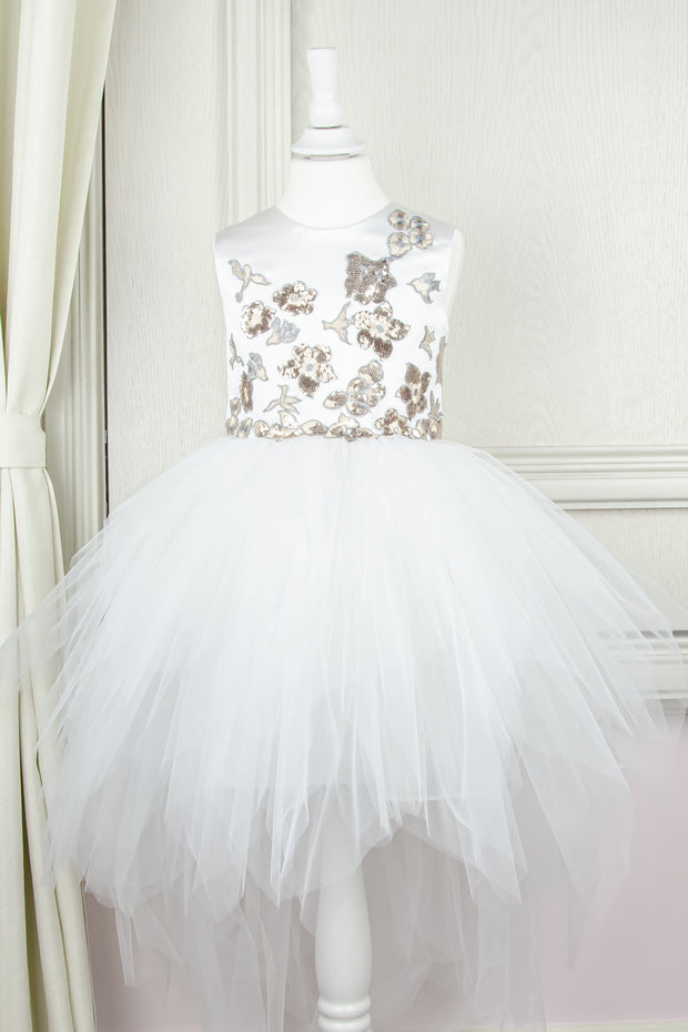 custom made personalised girl dress with an asymmetrical white tulle skirt and gold sequin embroidery in flower and birds pattern