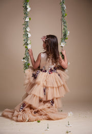 custom made, personalised girl dress in beige with a high-low hem, multi-layered tulle skirt and sequin embroidery in gold and red