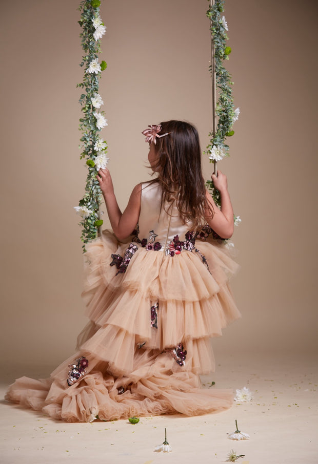 custom made, personalised girl dress in beige with a high-low hem, multi-layered tulle skirt and sequin embroidery in gold and red
