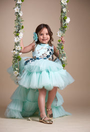 custom made personalised girl tulle dress with high-low hemline, mint tulle skirt and gold and blue sequin embellishments