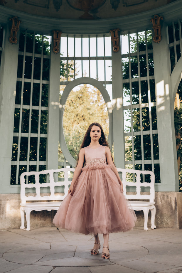 A unique dress perfect for a unique girl. The statement skirt is the highlight of this dress and the floral embroidered waist belt provides the touch it needs to be used in any special ocassion. Paired with a comfortable sleeveless satin top that completes the entire look.