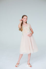 handmade, elegant girl dress with an a-line silhouette, midi length tulle skirt, floral embroidery and short sleeves in soft pastel colours, for flower girls dresses, weddings, birthdays, eid and other special occasions.