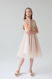 handmade, elegant girl dress with an a-line silhouette, midi length tulle skirt, floral embroidery and short sleeves in soft pastel colours, for flower girls dresses, weddings, birthdays, eid and other special occasions.